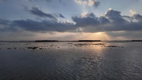 Beautiful-sunset-over-Songkhla-Lake-from-a-view-above-the-calm-water-surface