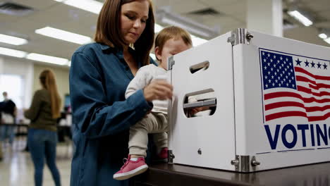 mother and child at a voting booth during an election