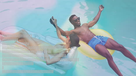 couple relaxing on pool floats with abstract data animation overlay