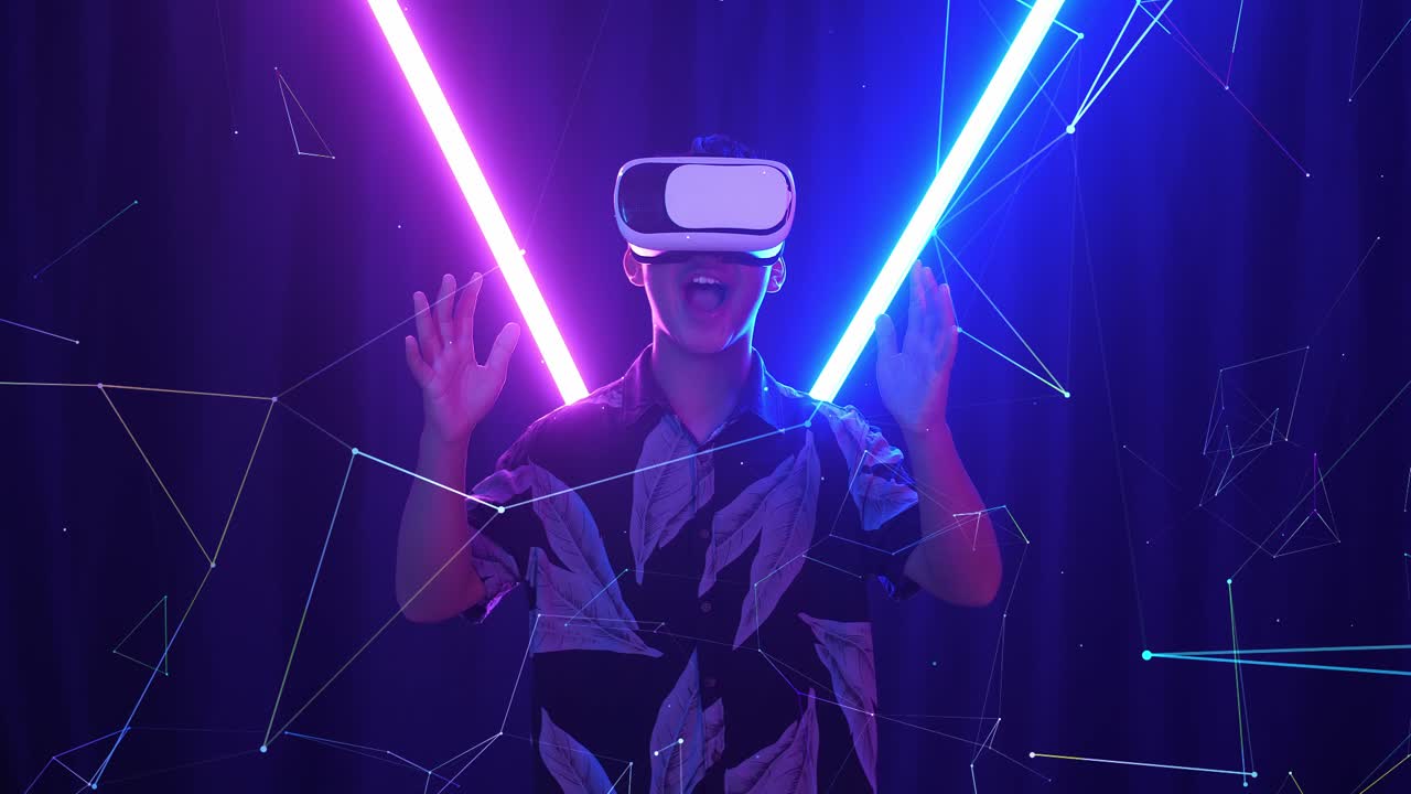 Vr, Futuristic, Entertainment Concept. Excited Asian Boy Using Virtual Reality Headset With Neon Light At The Background