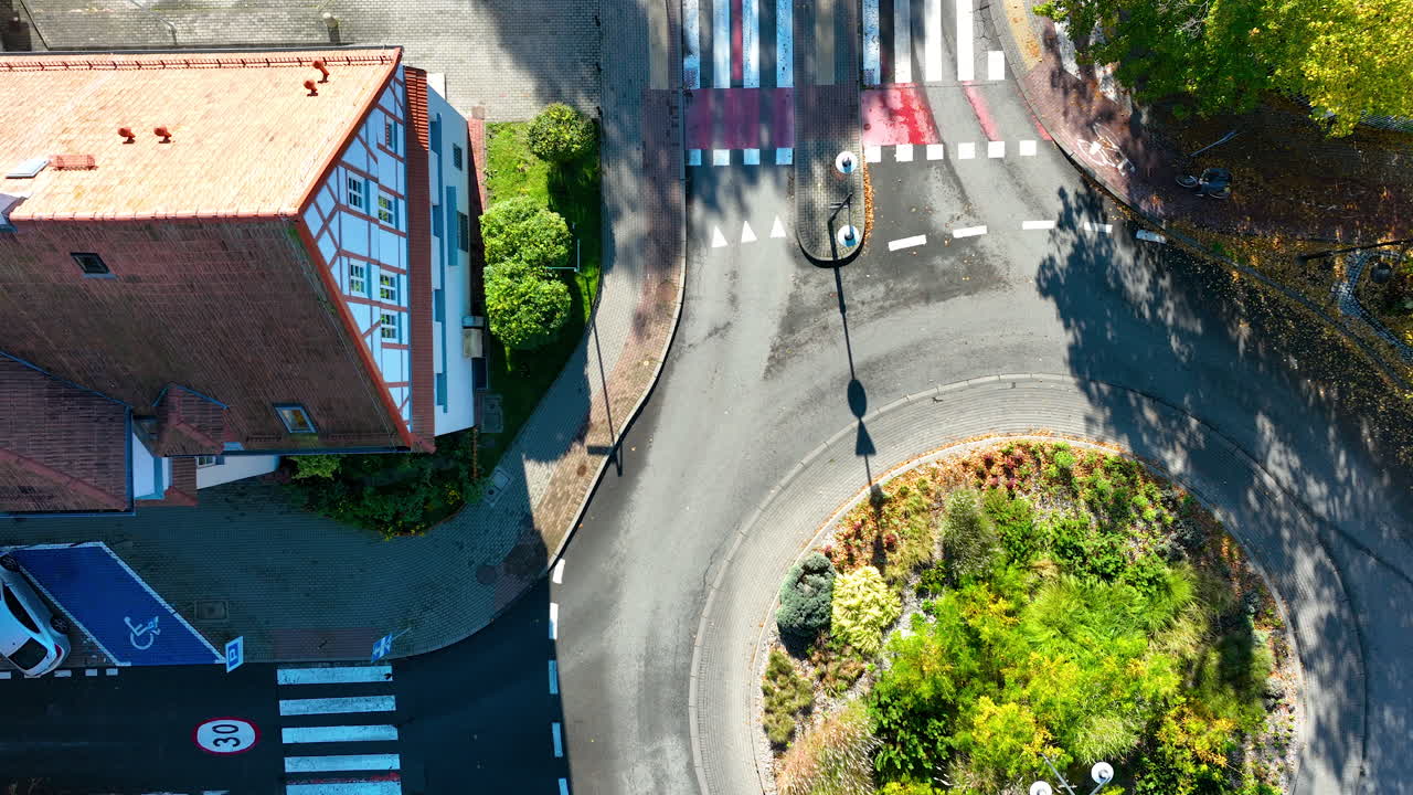 Aerial vertical view of a landscaped roundabout surrounded by quiet suburban streets in Sopot