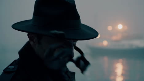 mysterious figure on a foggy waterfront pier at night
