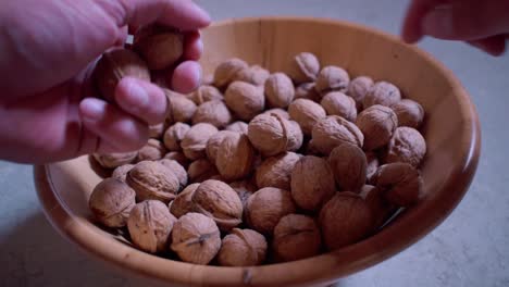 Dried walnuts in a wooden bowl-13