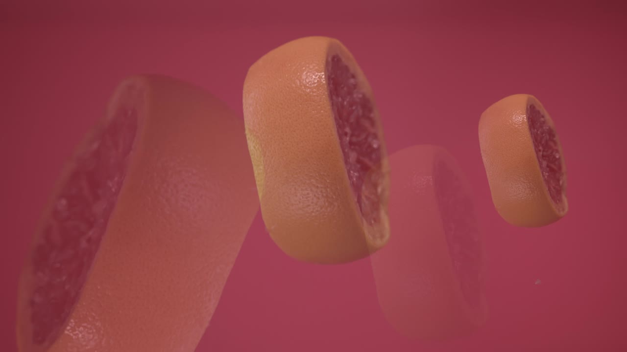 신선한 그레이프프루트 조각과 칠리 페퍼가 공중에 매달려서 날아다니며 떨어집니다.