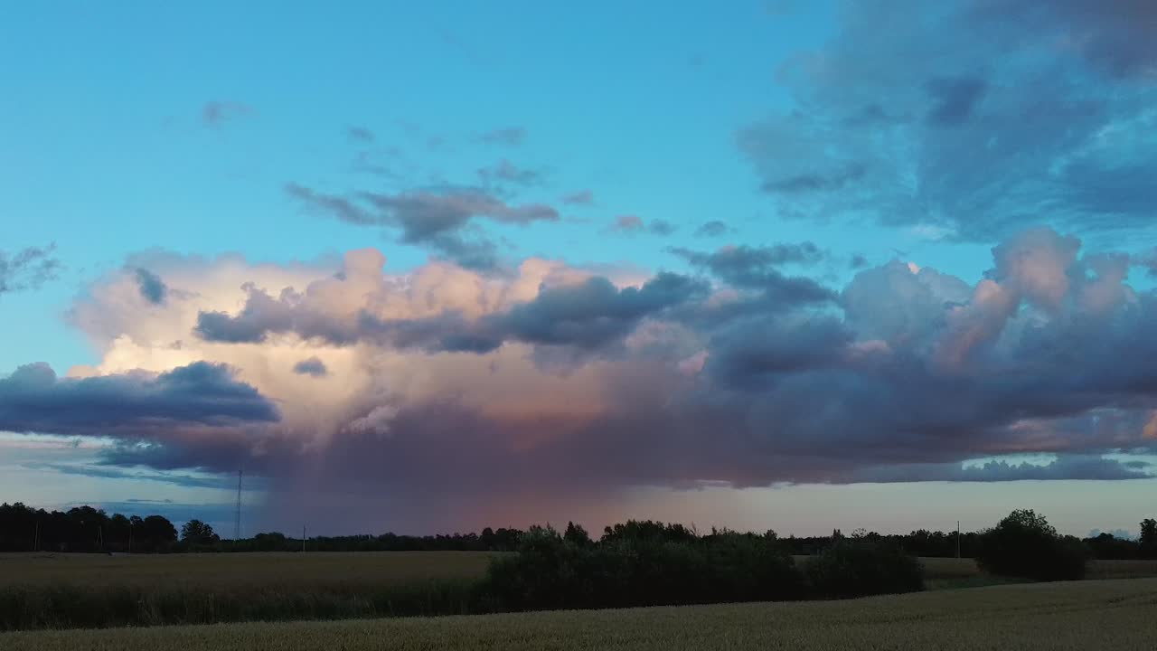 Storm Clouds With the Rain. Nature Environment Tornado Warned Supercell Storm Rolling Through the Plains. Crop Field After Rain and Storm Clouds in Background Rural Countryside. Aerial Dron Shot