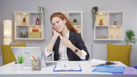home office worker woman has neck pain.