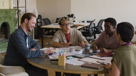 diverse team celebrating success and collaboration in an office setting