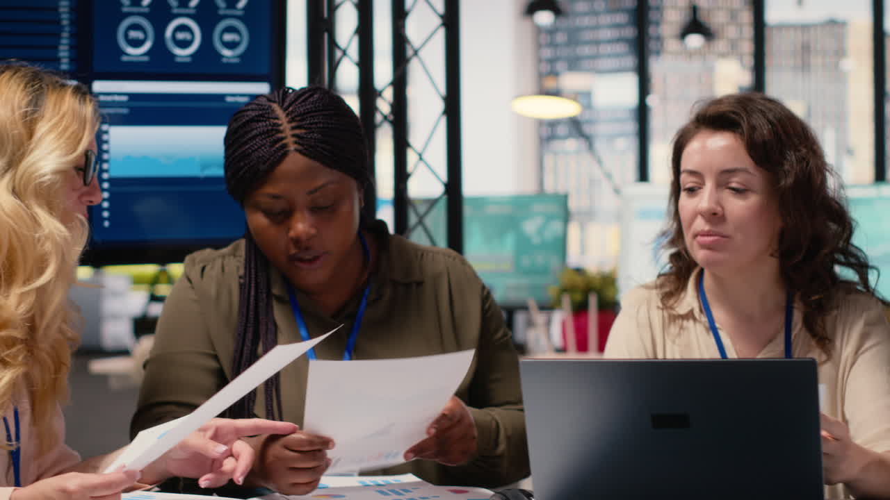 Vertical Video Women leaders group collaborate over performance indicators