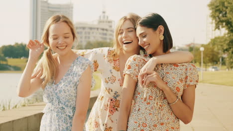 three happy women friends enjoying time outdoors