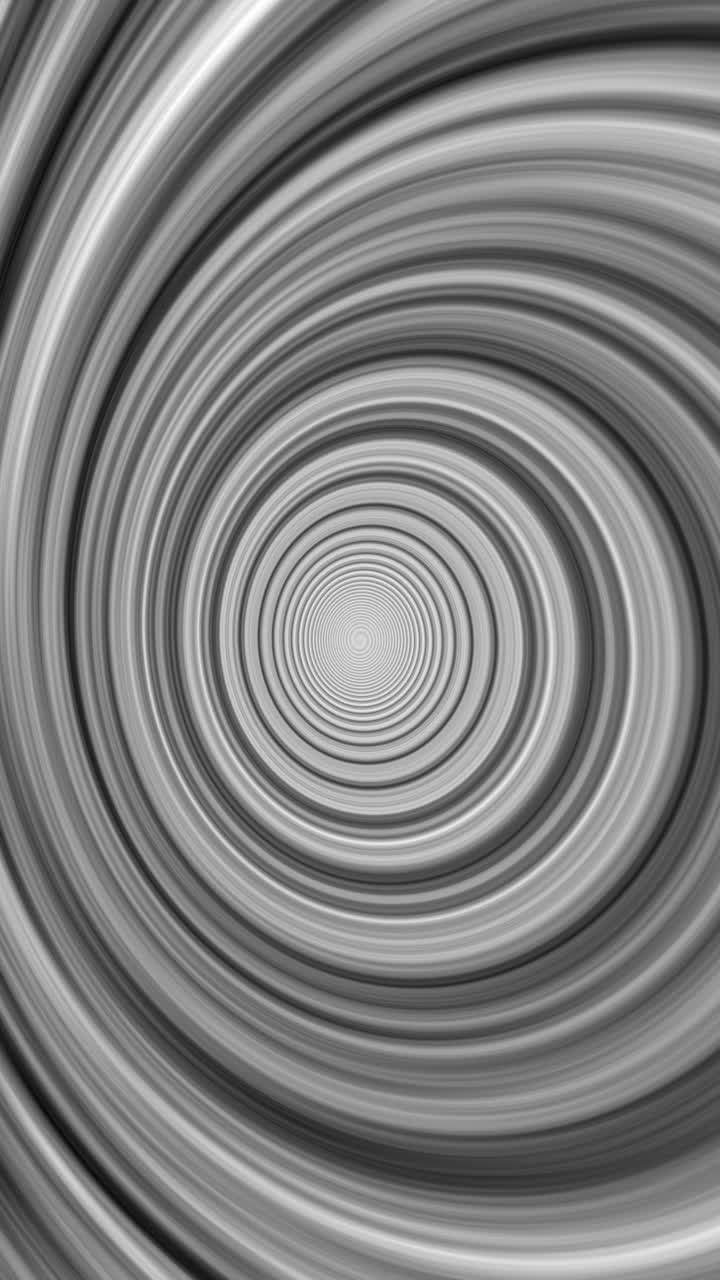 Seamless loop abstract background of hypnotic black and white rings. Vertical format for social media stories, reels, and tiktok