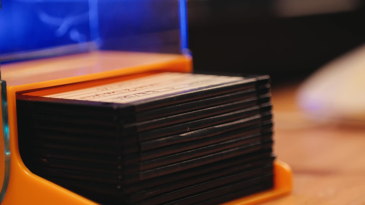 Using diskette for old computer. Music recorder, playing retro computer games. Vintage device for office, obsolete technology. . High quality 4k footage