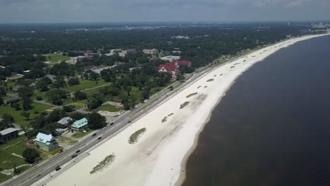 truck driving off in the distance off the shore in long beach, mississippi