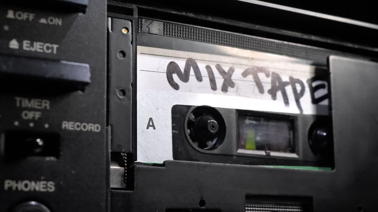 Cassette Tape. Vintage Tape Recorder Plays Audio Cassette tape. Nice dolly shot around tape.