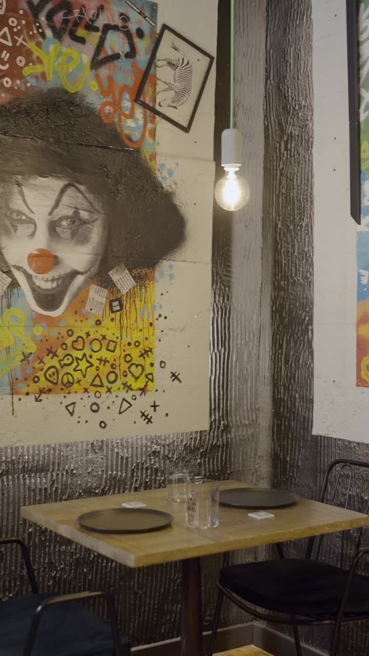 Urban Restaurant Interior with Eclectic Graffiti Art and Dining Table