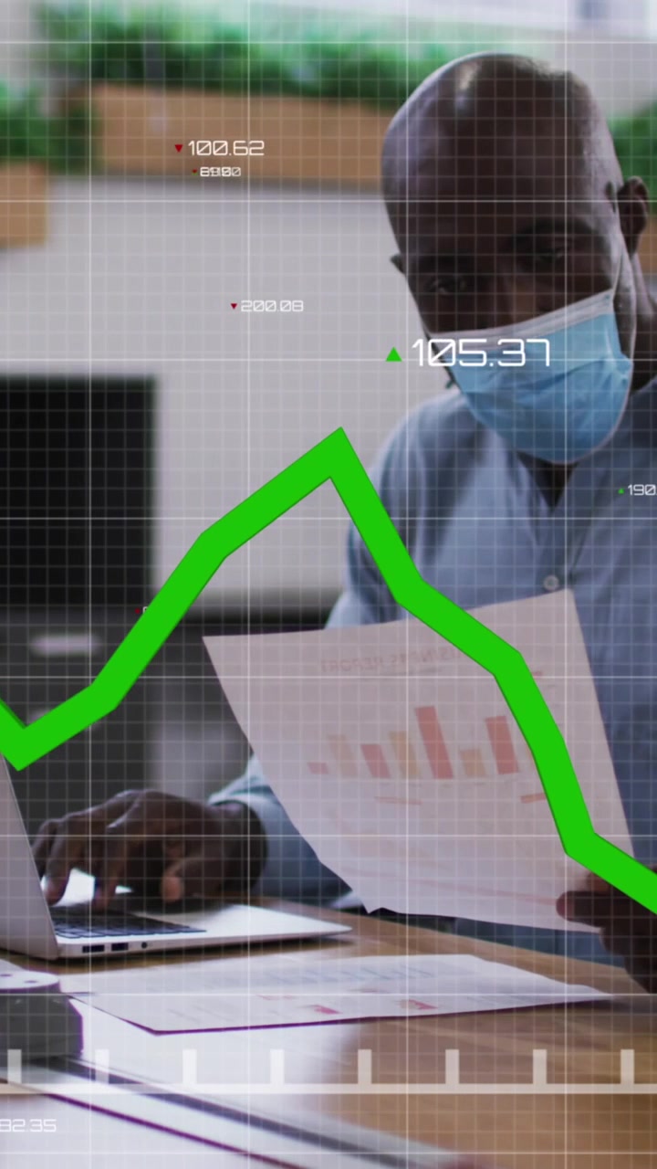 Animation of financial graph over african american men wearing face mask