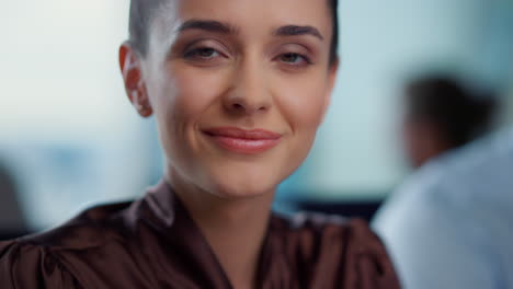 smiling businesswoman looking at camera.cheerful lady with happy face expression