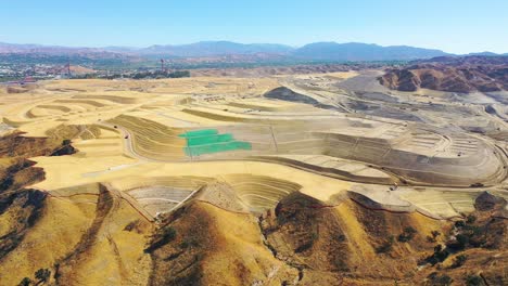 Aerial-over-a-massive-vast-giant-tract-home-contruction-project-development-in-the-hills-above-Santa-Clarita-California-suggests-Los-Angeles-urban-sprawl-5