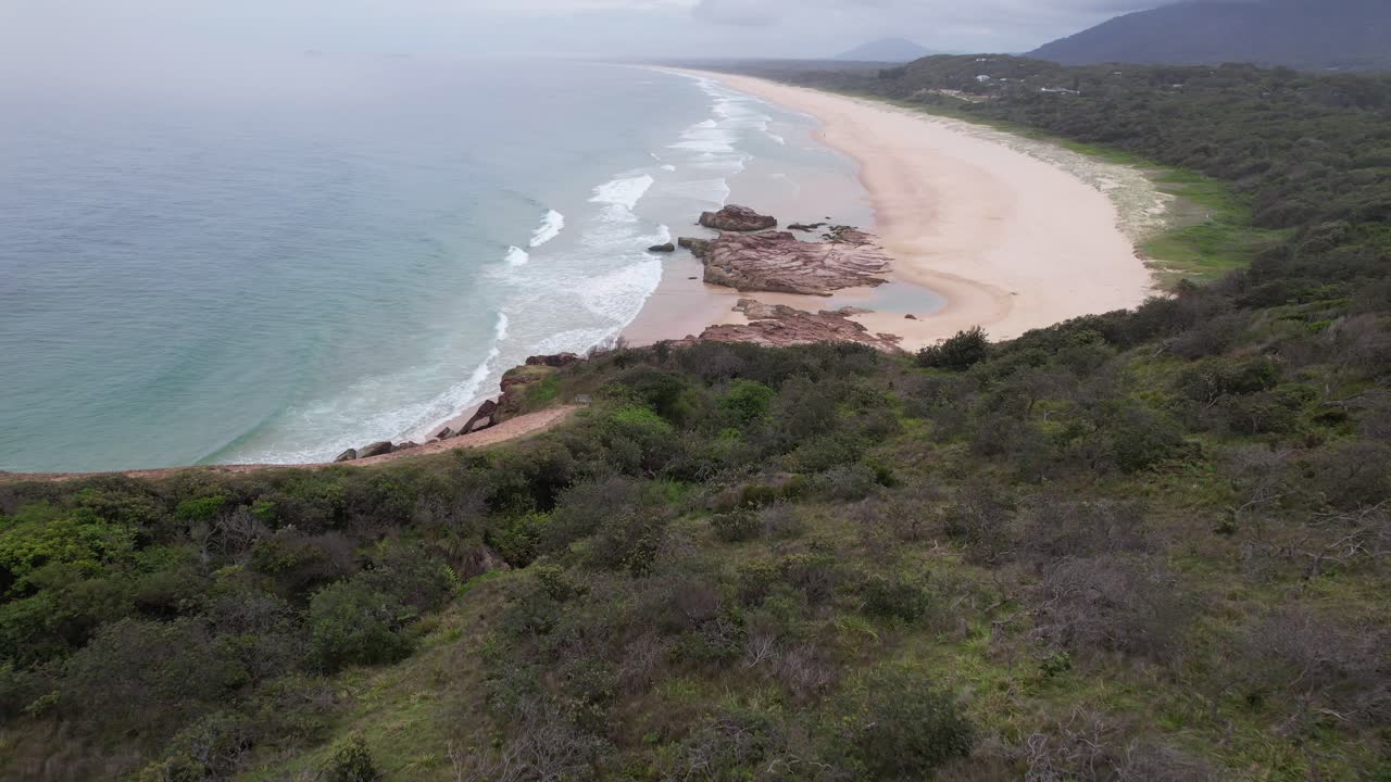 Kattang Nature Reserve Overlooking Dunbogan Beach And Gogleys Bay In Camden Head, NSW, Australia. aerial pullback shot