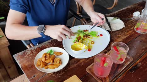 person eating meal at a restaurant