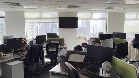 morning view of empty open office with hong kong skyline in background