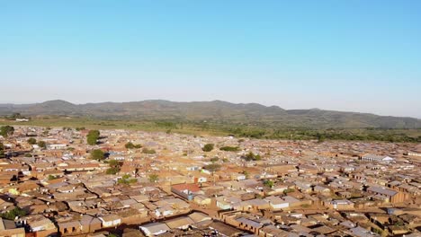 african city from above, traveling in malawi, aerial pan right