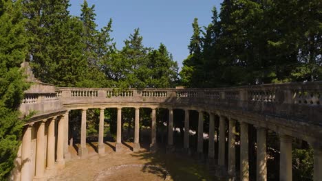 Slow-aerial-rising-shot-of-a-Roman-archway-at-the-Chateau-de-Castille