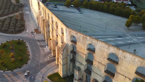 a complex parallax shot of an aqueduct in elvas, portugal, with golden hour lighting