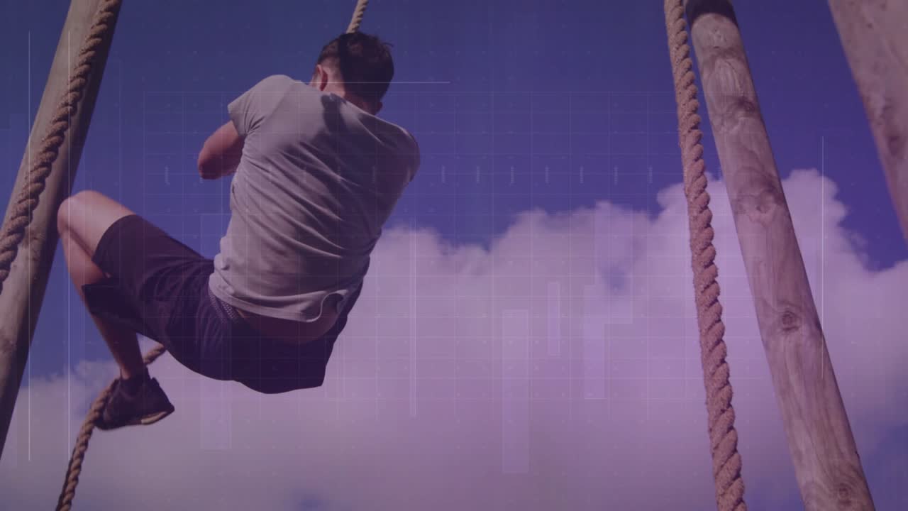 Adult male climber gripping rope and pulling upward, wrapping legs, securing hold for training