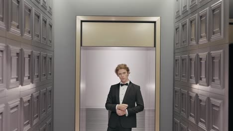 man in tuxedo in an elevator