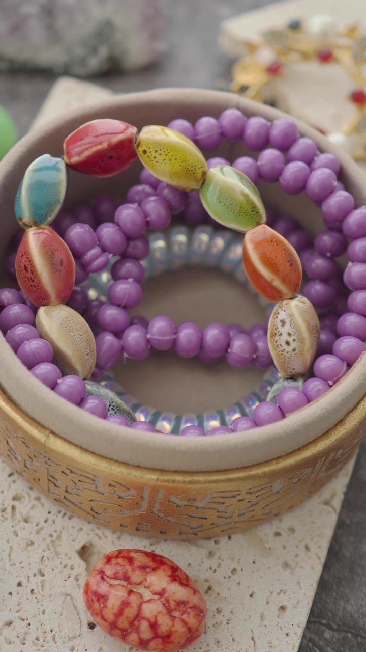 Colorful Beaded Bracelets Inside a Decorative Round Box