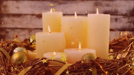 Animation-of-glowing-stars-falling-over-christmas-candles-and-baubles