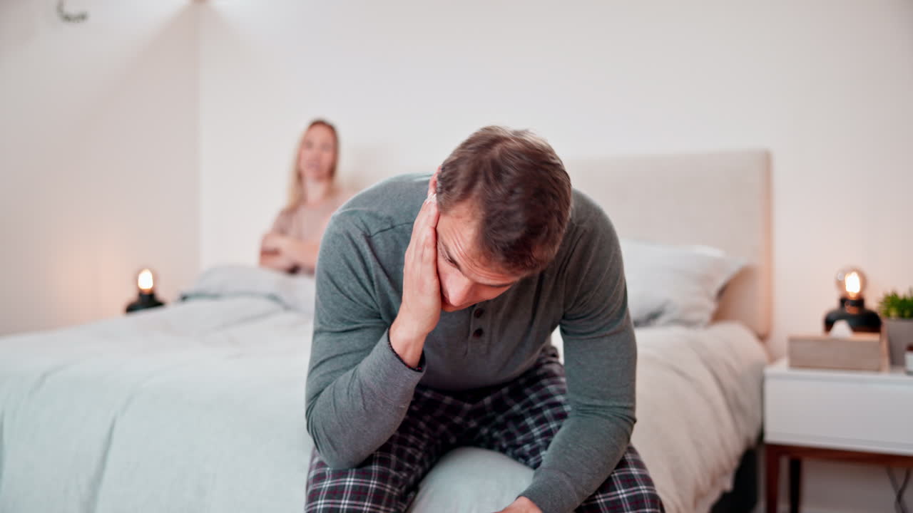Man, stress and conflict of couple in bedroom