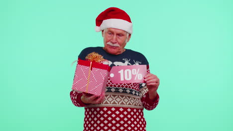 grandfather in christmas sweater showing gift box and 10 percent discount inscriptions banner text