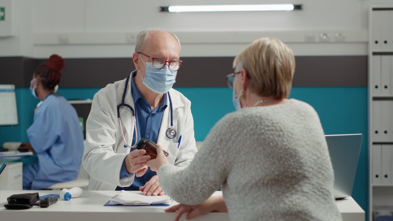 General practitioner giving bottle of pills as disease treatment