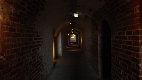 a dimly lit brick tunnel in melbourne