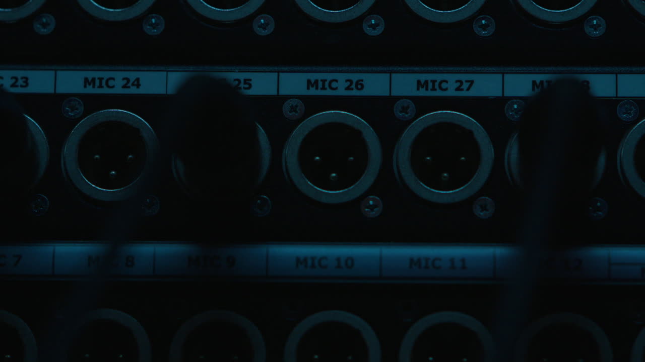Close-up of a professional audio mixer patchbay