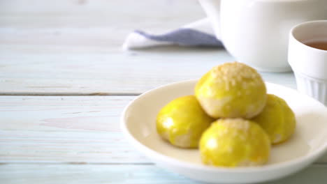 chinese pastry or moon cake filled with mung bean paste and salted egg yolk