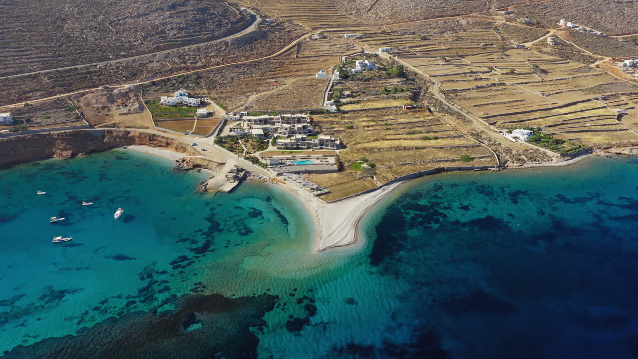 Aerial landscape of Aegiali shoreline and luxury sailboats in Amorgos island, Greece