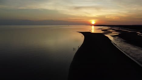 bright sunset reflecting on calm lake water