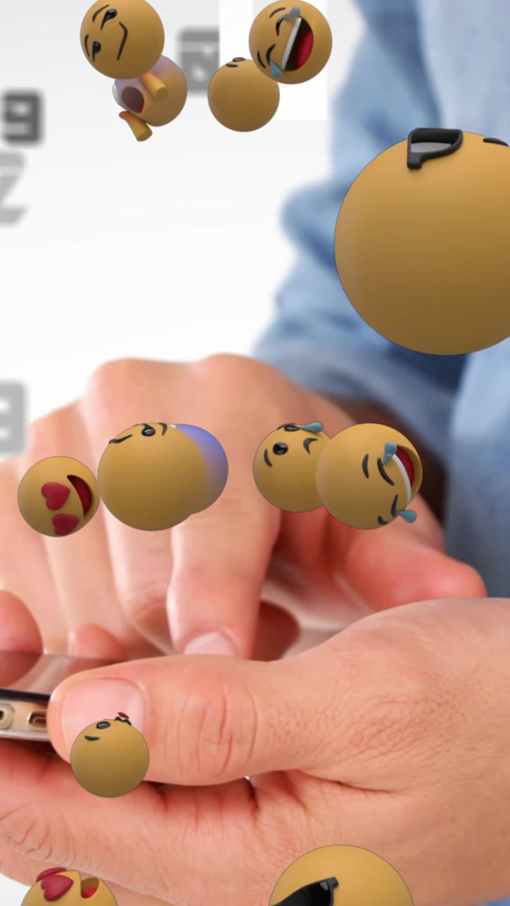 Animation of emoji icons floating and midsection of man using smartphone