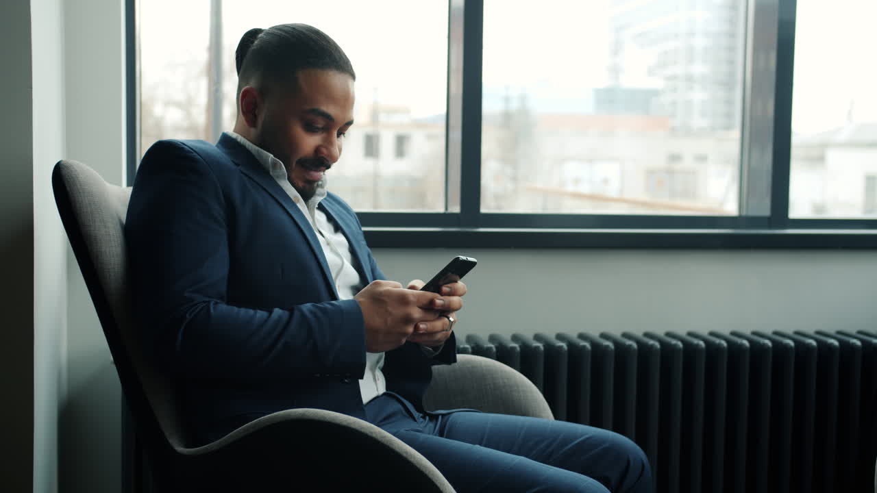 Businessman using smartphone in office