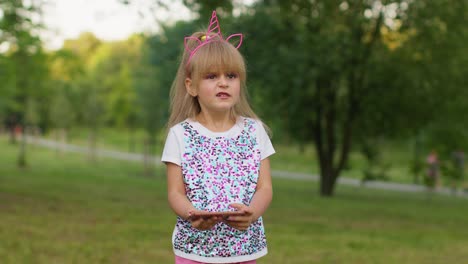 children girl loses on mobile phone game, use squishy silicone anti-stress pop it toy to calm down