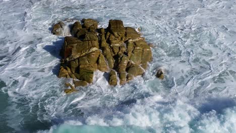 Sea-Waves-Crashing-Among-Rocks-At-Praia-de-Valcovo-Beach-In-Spain---Slow-Motion