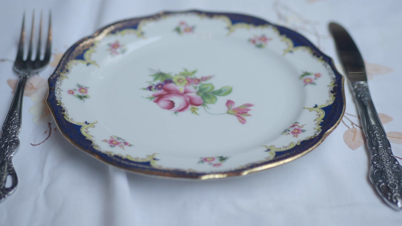 Placing Fork and Knife Next to a Vintage Floral Dinner Plate