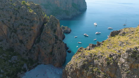 stunning aerial view of a mediterranean bay with boats and beach
