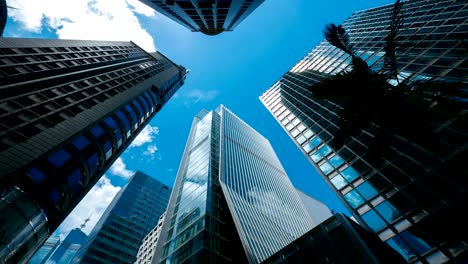 skyscrapers over blue sky, timelapse