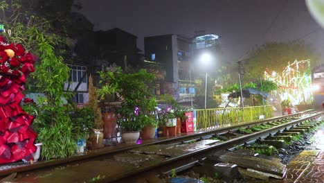 nighttime train journey through vibrant hanoi streets