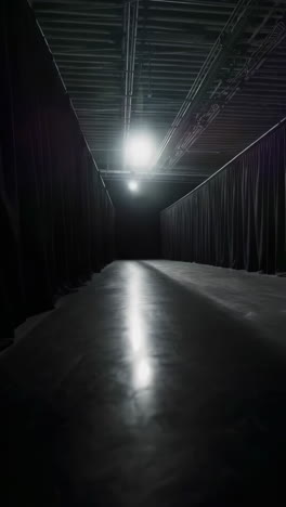 empty dark studio with black curtains