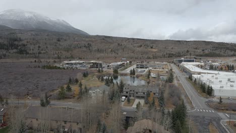 Aerial-panning-view-of-Frisco-with-Interstate-70-and-fresh-snow-in-the-distance