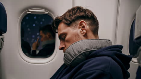 man sleeping on airplane